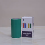 Green roll of tape with a white box labeled 'Acharya Print Opyal Tape' on a light background